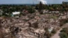 Разрушенные дома в городе Привилле на Луганщине в результате масштабного вторжения России в Украину, 14 июня 2022 года