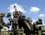 Украинские военные наносят огневые удары поражения по скоплению российской техники с американской гаубицы M777 вблизи линии фронта Донецкой области, 6 июня 2022 года