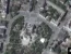 Супутниковий знімок зруйнованої будівлі театру в Маріуполі, поряд з яким з'явилися будівельні крани та вантажні машини, Україна, 12 травня 2022 року (фото надане Maxar Technologies)
